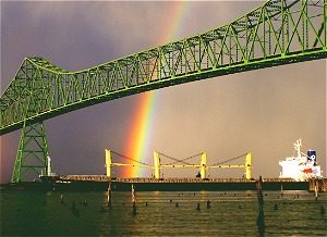 Bridge with rainbow behind it